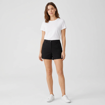 AI concept: adult young woman styling black high-waisted mini shorts